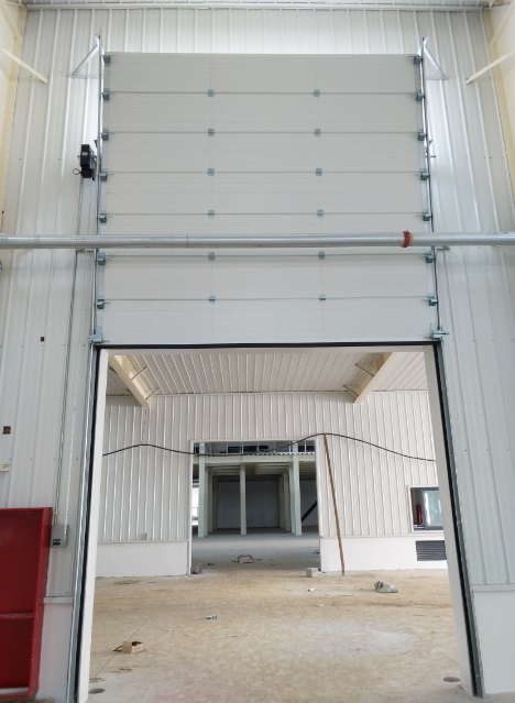 獲嘉縣童欣科技工業(yè)提升門案例 - 中出網(wǎng)-智能出入口與停車充電門戶